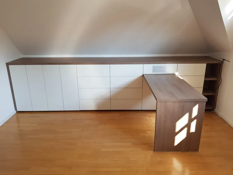 Full attic wall with built-in wardrobes